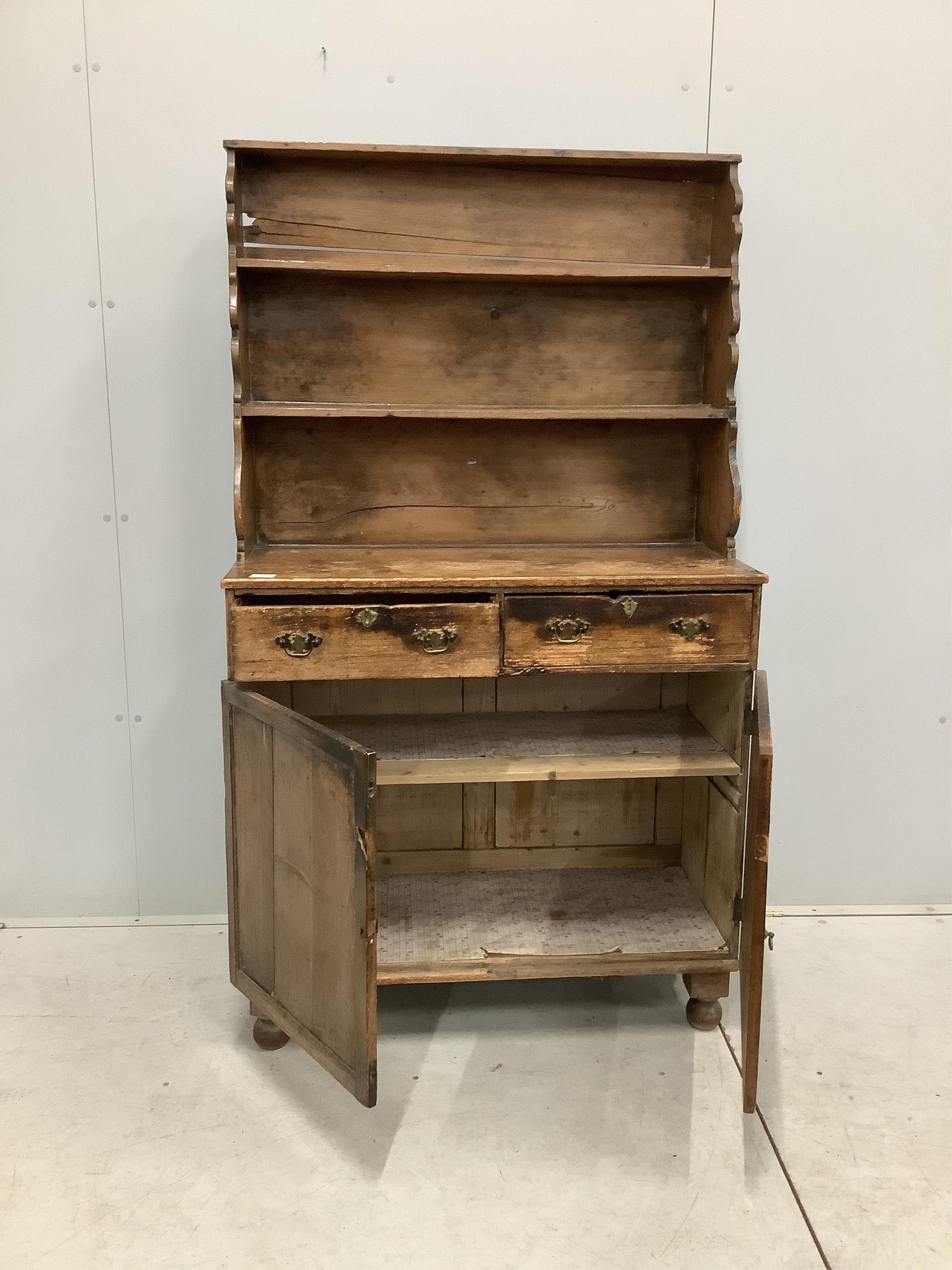 A 19th century Provincial stripped pine Welsh dresser, width 92cm, depth 41cm, height 160cm. Condition - poor